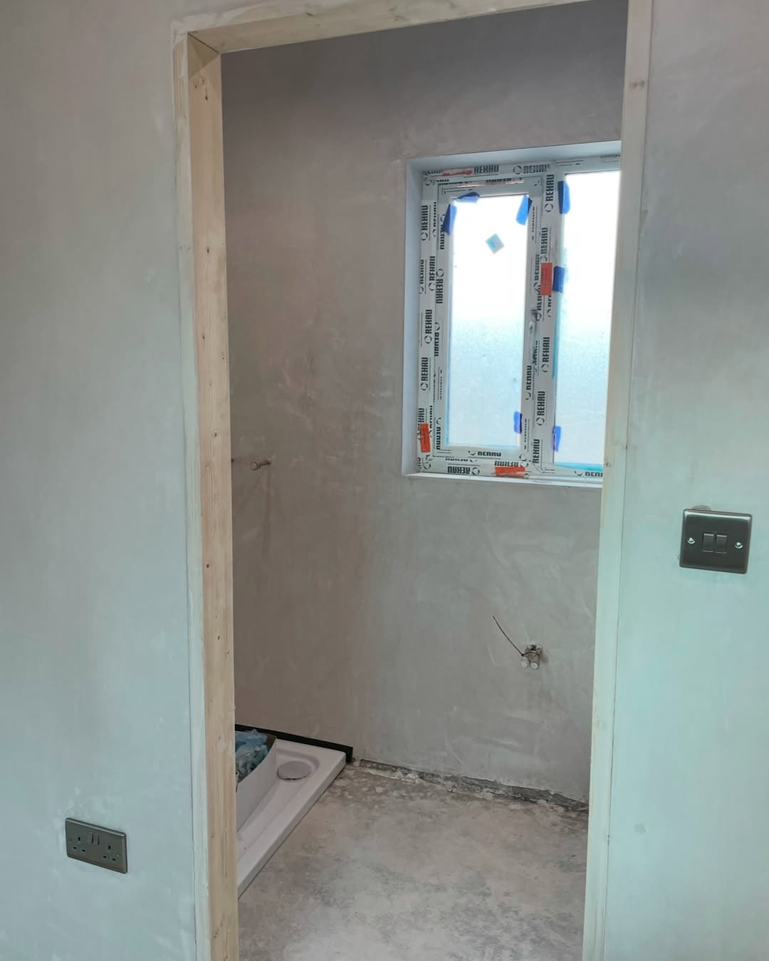 Compact bathroom before renovation with rough shower prep